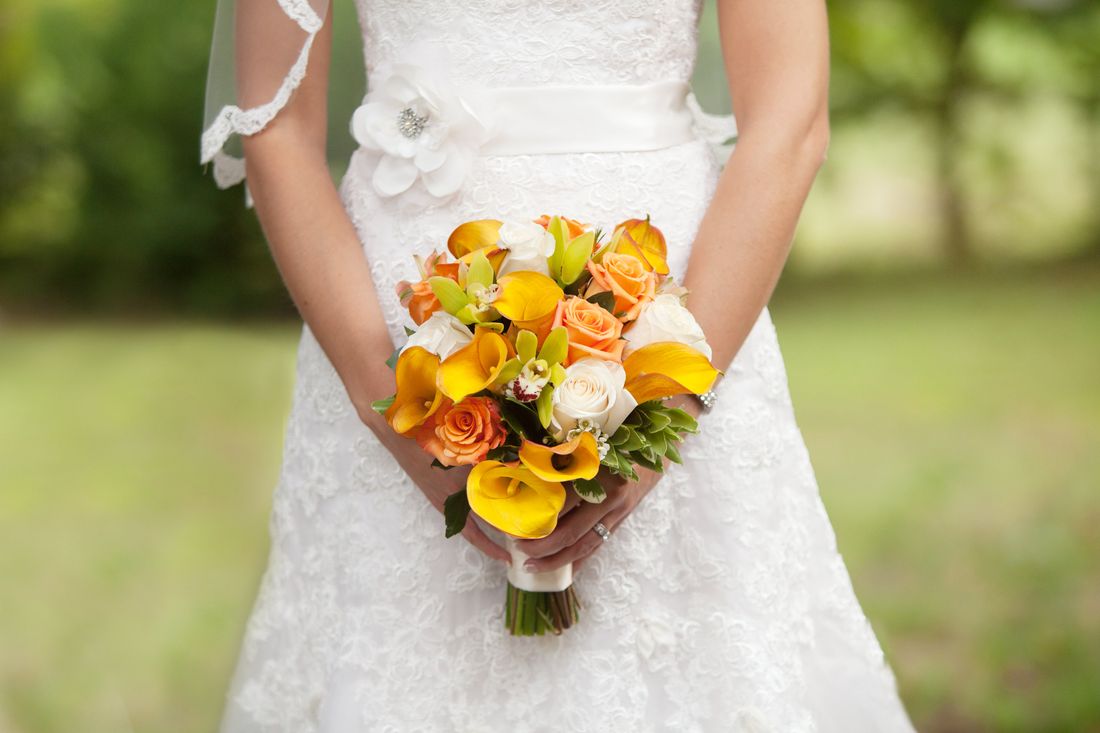 The bouquet against the lace dress