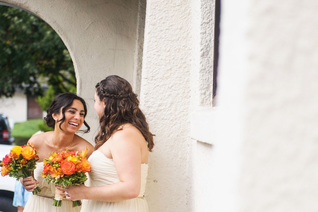Devin laughing with a bridesmaid