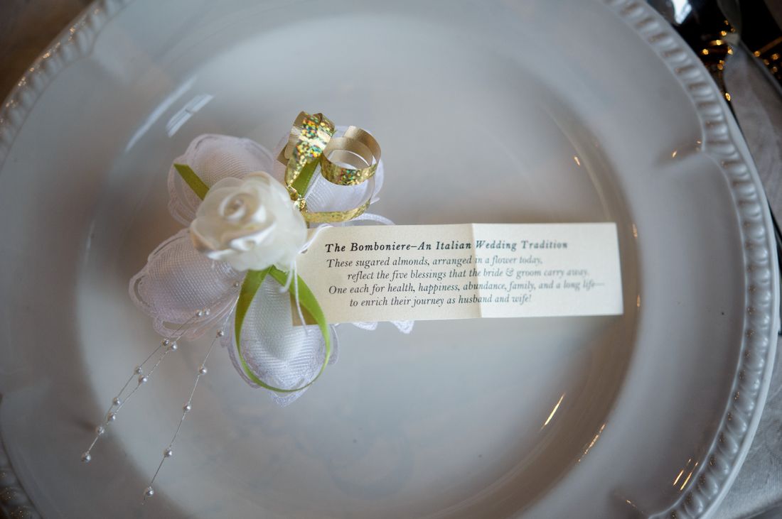 A bomboniere favor and its note at a place setting &mdash; the Italian wedding tradition Devin&rsquo;s aunt made by hand