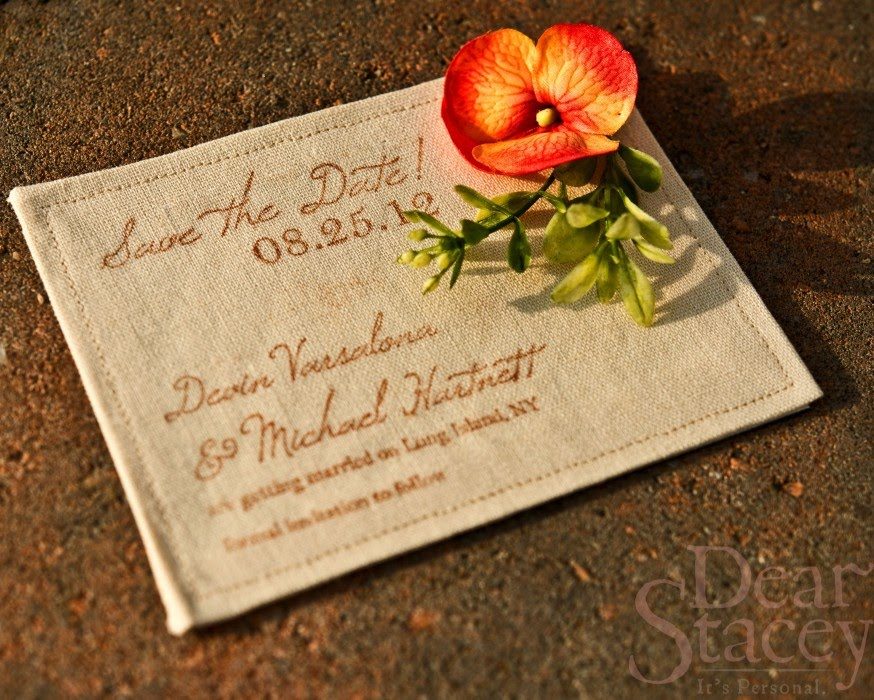 The save-the-date &mdash; stamped archival ink on linen with a coral flower