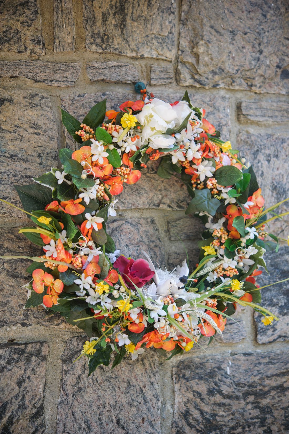 Floral wreath on a stone wall